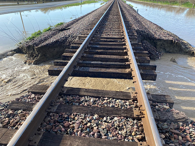 Collapsing tracks with water running underneath the tracks Collapsing tracks with water running underneath the tracks