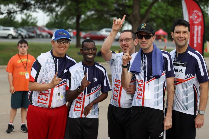 Special Olympics athletes celebrating their wins. Special Olympics athletes celebrating their wins.